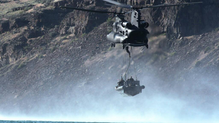 US Army helicopter drops an entire boat full of Navy Seals in the sea